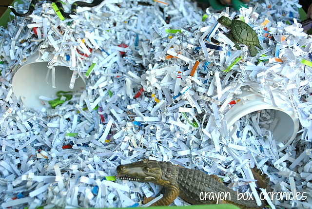 Reptile Shredded Paper Sensory Bin by Crayon Box Chronicles