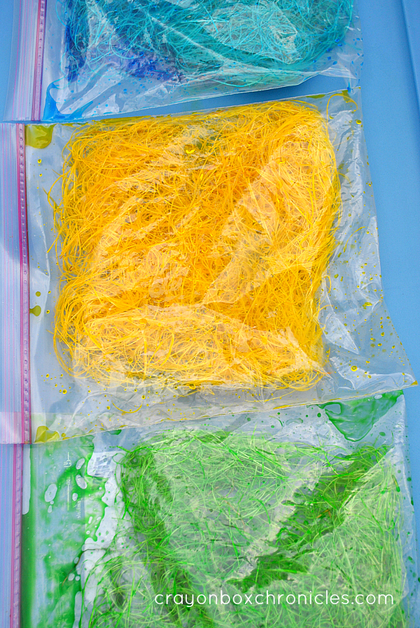 coloring hay in bags for sensory play 
